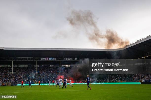 Both teams leave the pitch as the match is interrupted during the Third League Playoff Leg 2 match between SV Waldhof Mannheim and KFC Uerdingen at...