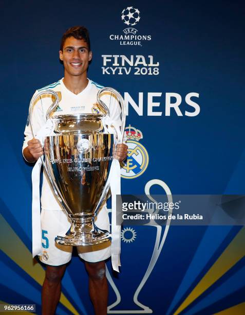 Raphael Varane of Real Madrid poses with the Champions League trophy after the UEFA Champions League Finall match between Real Madrid and Liverpool...