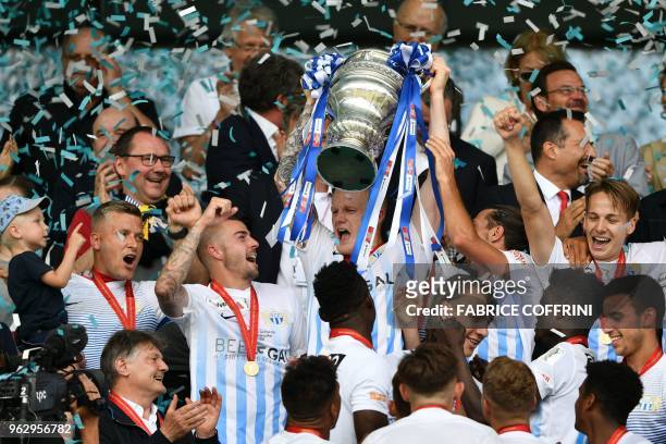 Zurich's players raise the trophy after winning the Swiss Football Cup final match between FC Zurich and BSC Young Boys at the Stade de Suisse...