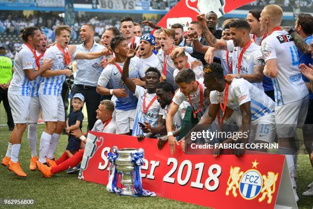 Zurich's players raise the trophy after winning the Swiss Football Cup final match between FC Zurich and BSC Young Boys at the Stade de Suisse...