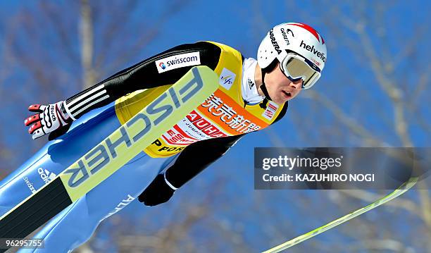 Simon Ammann of Switzerland launches himself into the air during his first jump on the second day of the World Cup ski jumping Sapporo meet at...