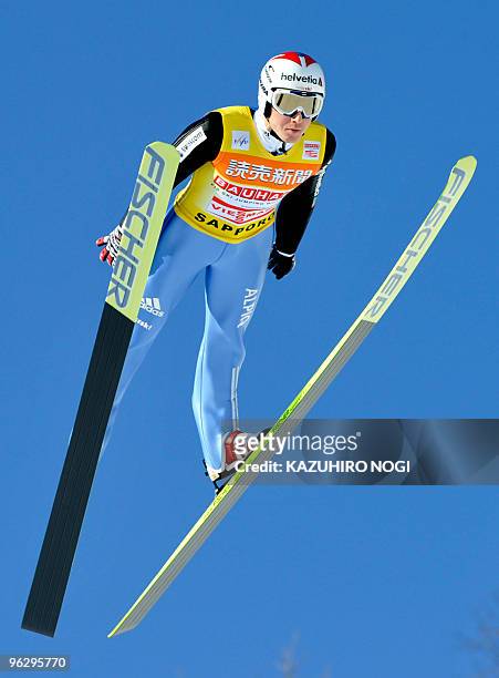 Simon Ammann of Switzerland launches himself into the air during his first jump on the second day of the World Cup ski jumping Sapporo meet at...
