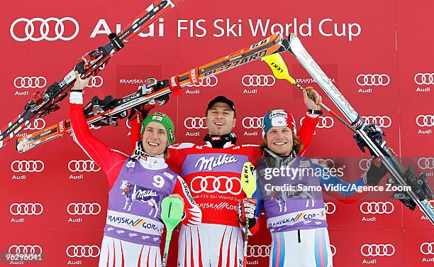 Reinfried Herbst of Austria takes 1st place, Marcel Hirscher of Austria takes 2nd place and Julien Lizeroux of France takes 3rd place during the Audi...