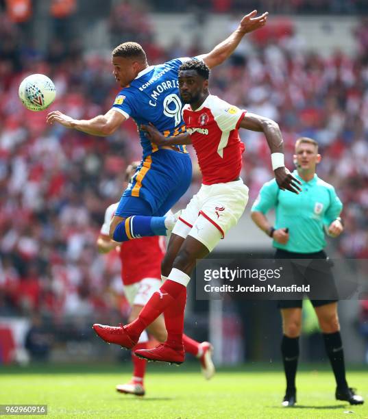 Carlton Morris of Shrewsbury Town jumps with Semi Ajayi of Rotherham United during the Sky Bet League One Play Off Final between Rotherham United and...