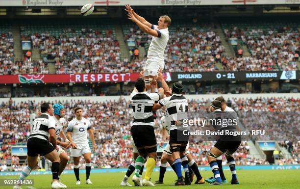 Joe Launchbury of England jumps highest in the lineout during the Quilter Cup match between England and Barbarians at Twickenham Stadium on May 27,...