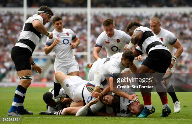Elliot Daly of England touches down for their first try during the Quilter Cup match between England and Barbarians at Twickenham Stadium on May 27,...