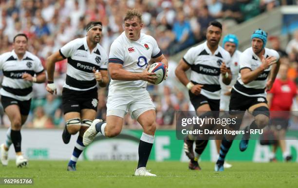 Jack Singleton of England breaks with the ball during the Quilter Cup match between England and Barbarians at Twickenham Stadium on May 27, 2018 in...