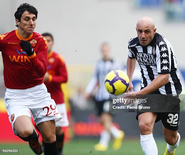 Nicolas Burdisso of AS Roma and Massimo Maccarone of AC Siena compete for the ball during the Serie A match between Roma and Siena at Stadio Olimpico...