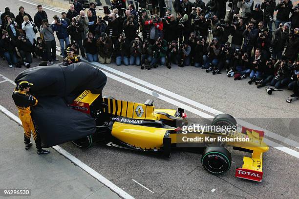 Robert Kubica of Poland and Vitaly Petrov of Russia unveil the new Renault R30 at the Ricardo Tormo circuit on January 31, 2010 in Valencia, Spain.
