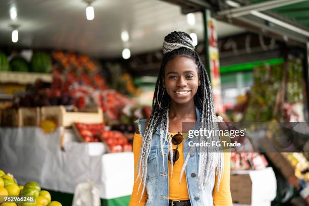 woman choosing fruits on feira - feira stock pictures, royalty-free photos & images