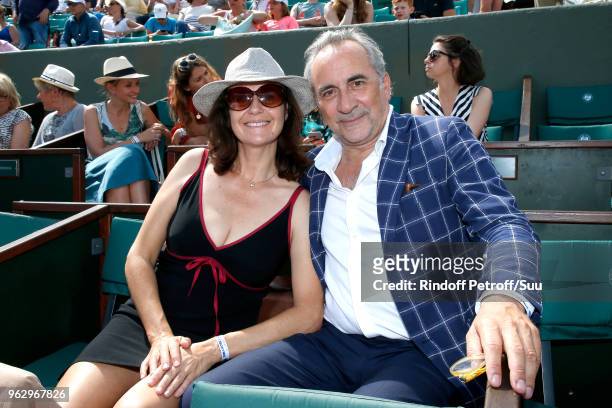 Actor Antoine Dulery and his wife Pascale Pouzadoux attend the 2018 French Open - Day One at Roland Garros on May 27, 2018 in Paris, France.