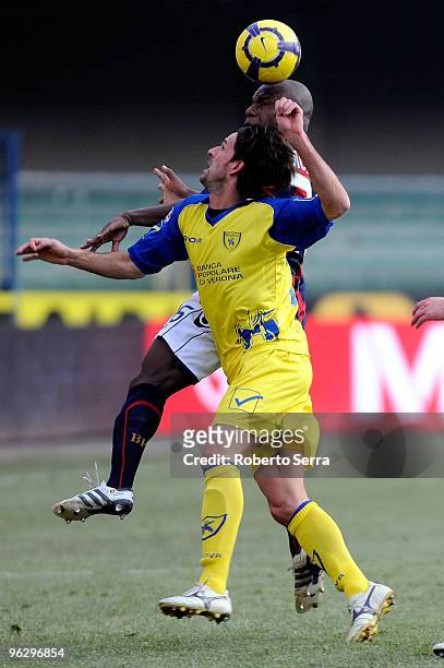 Gaby Mudingayi of Bologna competes with Luca Ariatti of Chievo Verona during the Serie A match between Chievo and Bologna at Stadio Marc'Antonio...