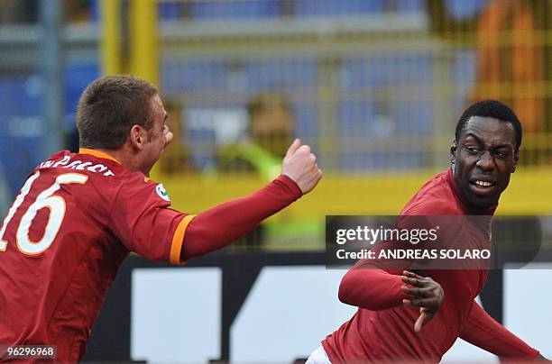 Roma's forward Stefano Chuka Okaka celebrates with teammate Daniele De Rossi after scoring against Siena during their Italian Serie A football match...