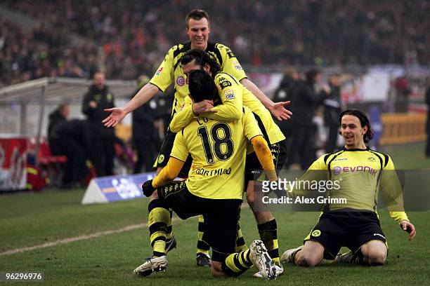 Lucas Barrios of Dortmund celebrates his team's first goal with team mates Nelson Valdez , Kevin Grosskreutz and Neven Subotic during the Bundesliga...