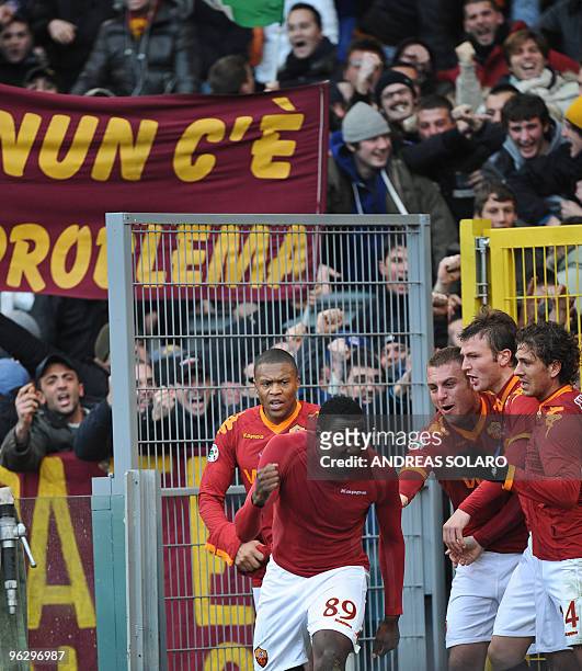 Roma's forward Stefano Chuka Okaka celebrates with teammates after scoring against Siena during their Italian Serie A football match on January 31,...