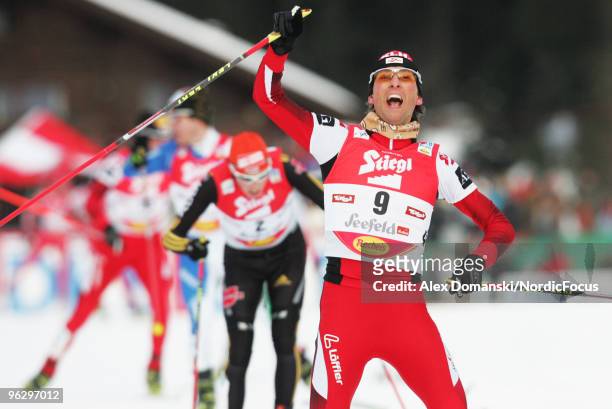 Mario Stecher of Austria celebrates after winning the Gundersen Ski Jumping HS 100/10km Cross Country event during day two of the FIS Nordic Combined...