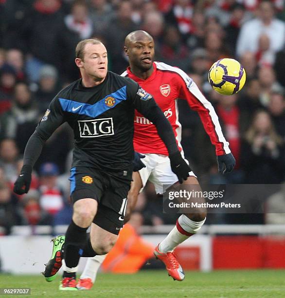 Wayne Rooney of Manchester United clashes with WIlliam Gallas of Arsenal during the FA Barclays Premier League match between Arsenal and Manchester...