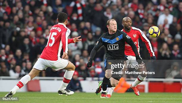 Wayne Rooney of Manchester United clashes with WIlliam Gallas of Arsenal during the FA Barclays Premier League match between Arsenal and Manchester...
