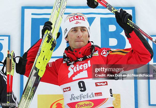 Mario Stecher of Austria celebrates after winning the Gundersen Ski Jumping HS 100/10km Cross Country event during day two of the FIS Nordic Combined...