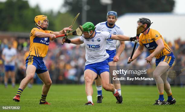 Clare , Ireland - 27 May 2018; Tom Devine of Waterford in action against Colm Galvin, left, and Jamie Shanahan of Clare during the Munster GAA...