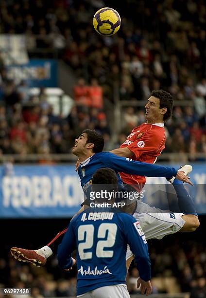 Mallorca's forward Aduriz Zubeldia vies with Xerez's defender Aythami Artiles during a Spanish league football match at Chapin stadium of Jerez,...