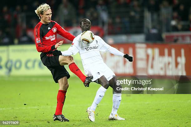 Sami Hyypiae of Leverkusen tackles Papiss Demba Cissé of Freiburg during the Bundesliga match between Bayer Leverkusen and SC Freiburg at the...