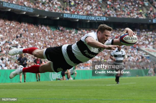 Chris Ashton of The Barbarians dives over the line to score a try during the Quilter Cup match between England and Barbarians at Twickenham Stadium...