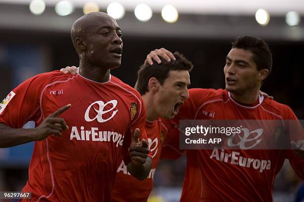 Mallorca's Cameroonian forward Pierre Webo celebrates with teammates Mallorca's forward Aritz Aduriz and Mallorca's Uruguayan midfielder Chori Castro...