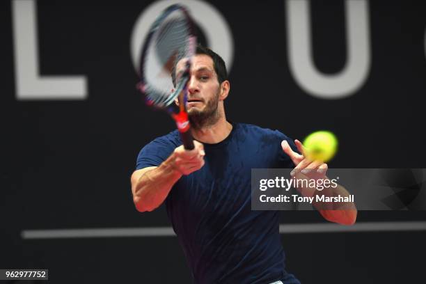 James Ward of Great Britain returns a shot against Hiroki Moriya of Japan in the Mens Singles Final during Day Nine of the Loughborough Trophy at...