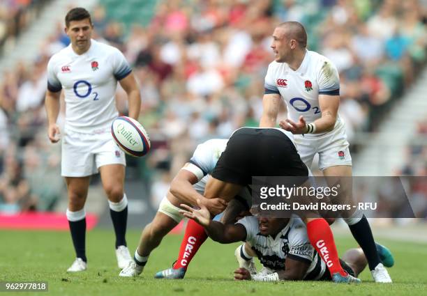Josua Tuisova of Barbarians passes the ball during the Quilter Cup match between England and Barbarians at Twickenham Stadium on May 27, 2018 in...