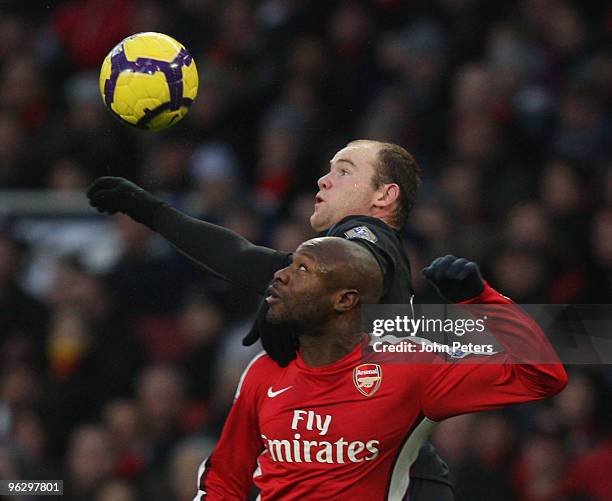 Wayne Rooney of Manchester United clashes with William Gallas of Arsenal during the FA Barclays Premier League match between Arsenal and Manchester...