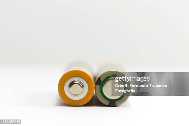 two batteries - alkaline stock pictures, royalty-free photos & images