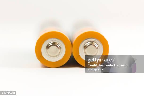 two batteries - alkaline stock pictures, royalty-free photos & images