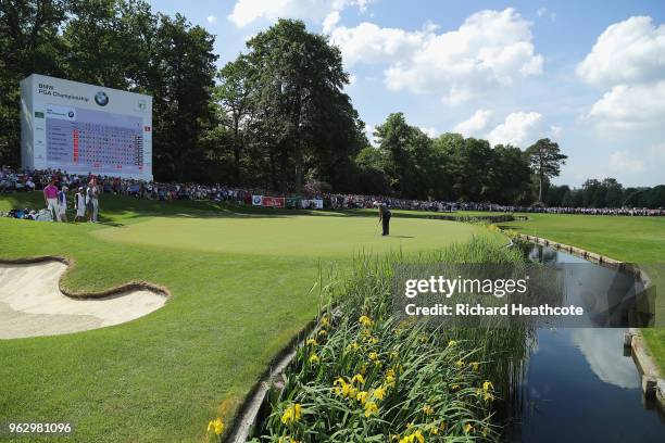 Francesco Molinari of Italy holes out on the 18th green to win during the final round of the BMW PGA Championship at Wentworth on May 27, 2018 in...