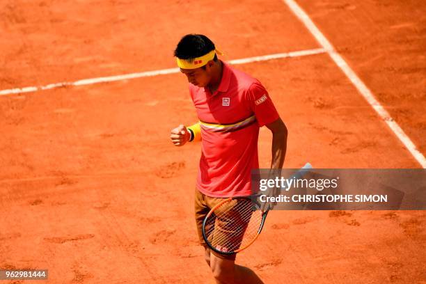 Japan's Kei Nishikori reacts after a point against France's Maxime Janvier during their men's singles first round match on day one of The Roland...