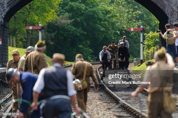 Volunteers from the Dad's Army Museum in Thetford attend a fire on the track at Weybourne Railway Station on May 27, 2018 in Weybourne, England. The...