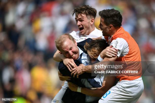 Zurich's Swiss head coach Ludovic Magnin celebrates with his players the victory of his team at the end of the Swiss Football Cup final match FC...
