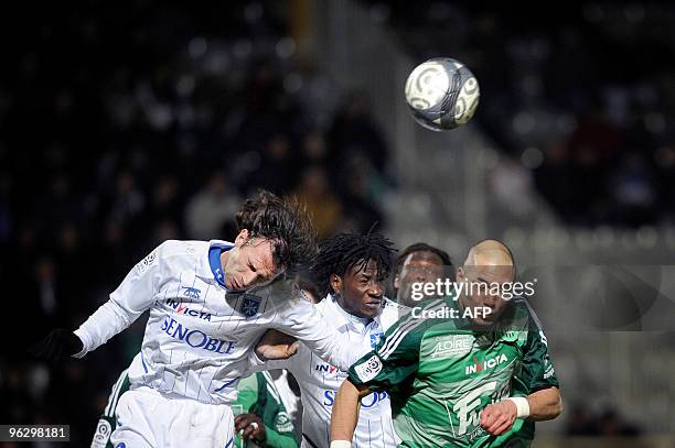 Auxerre's defender Cedric Hengbart vies with Saint-Etienne's defender Yohan Benalouane during their French L1 football match on January 31, 2010 at...