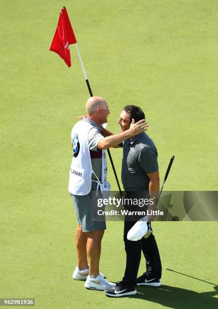 Francesco Molinari of Italy celebrates victory on the 18th green with his caddie during day four and the final round of the BMW PGA Championship at...