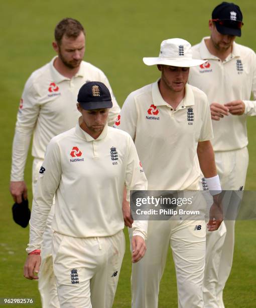 Joe Root leaves the field with Stuart Broad after England lost the 1st Natwest Test match between England and Pakistan at Lord's cricket ground on...