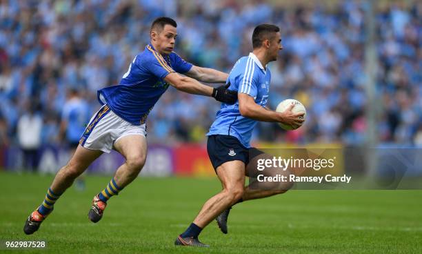 Laois , Ireland - 27 May 2018; James McCarthy of Dublin is tackled by John McGrath of Wicklow during the Leinster GAA Football Senior Championship...