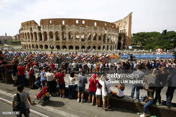 The pack rides past the ancient Colosseum during the 21st and last stage of the 101st Giro d'Italia, Tour of Italy cycling race, on May 27, 2018 in...