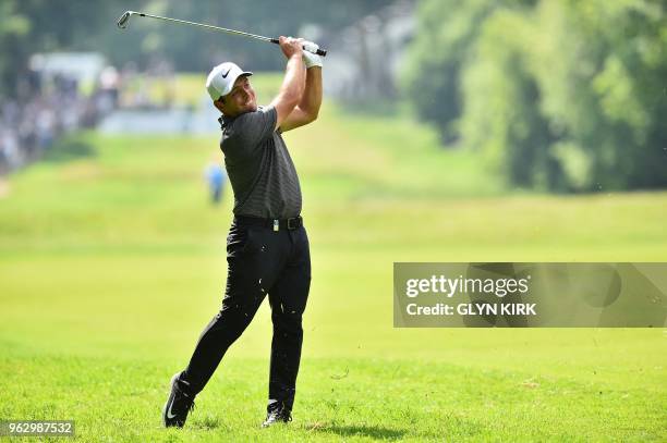 Italy's Francesco Molinari plays his second shot on the seventeeth hole on day four of the golf PGA Championship at Wentworth Golf Club in Surrey,...