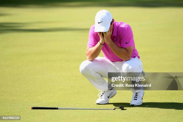 Rory McIlroy of Northern Ireland reacts to a missed eagle putt on the 18th green during the final round of the BMW PGA Championship at Wentworth on...