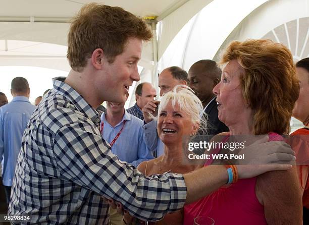 Prince Harry meets Cilla Black before playing in the inaugural Setebale Polo Cup at the Apes Hill polo club on January 31, 2010 in Apes Hill,...