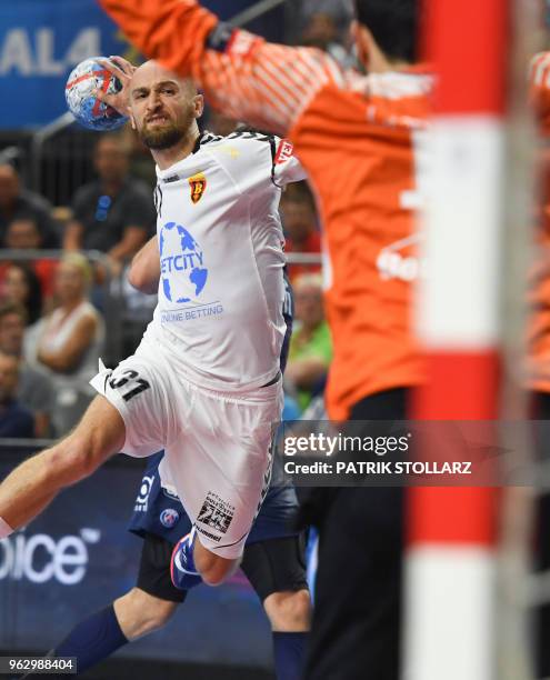 Vardar's Timur Dibirov shoots during the third place handball match HC Vardar against Paris Saint-Germain Handball at the EHF Pokal men's Champions...