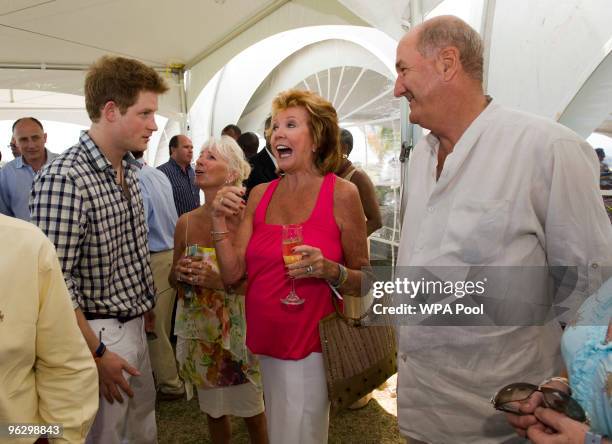 Prince Harry meets Cilla Black and Russ Abbot before playing in the inaugural Setebale Polo Cup at the Apes Hill polo club on January 31, 2010 in...