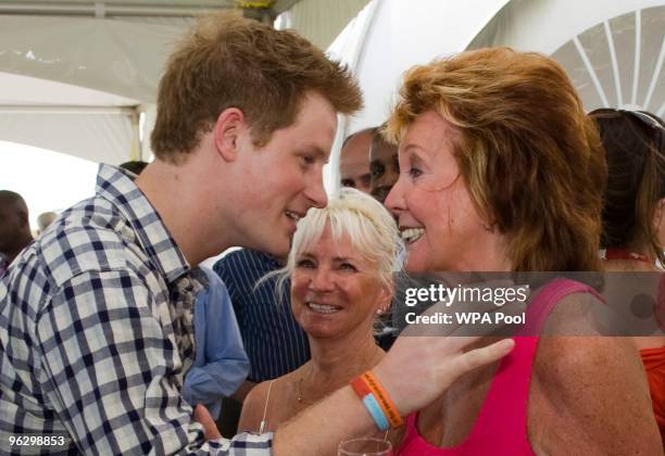 Prince Harry meets Cilla Black before playing in the inaugural Setebale Polo Cup at the Apes Hill polo club on January 31, 2010 in Apes Hill,...