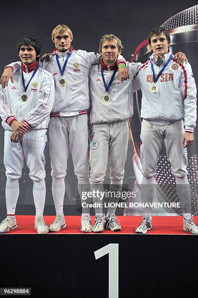 Team Russia celebrates on the podium after winning the Men's International Paris' Challenge Epee competition, on January 31, 2010. AFP PHOTO/LIONEL...