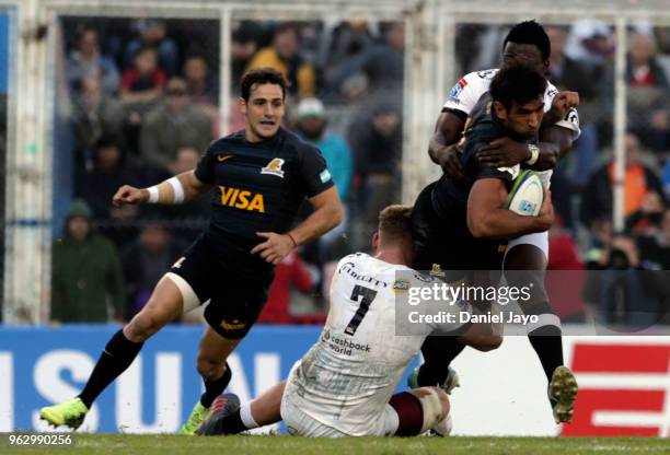 Matias Orlando of Jaguares is tackled by Jean-Luc du Preez of Sharks during a match between Jaguares and Sharks as part of Super Rugby 2018 at Jose...